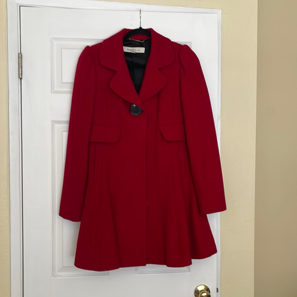 Red baby doll style coat.